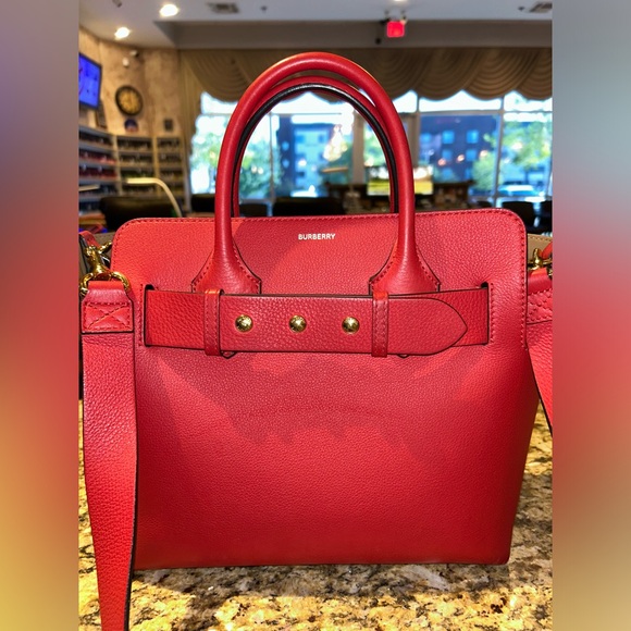 Authentic Burberry medium-sized tote in red, featuring gold studs on the front. - Picture 1 of 11